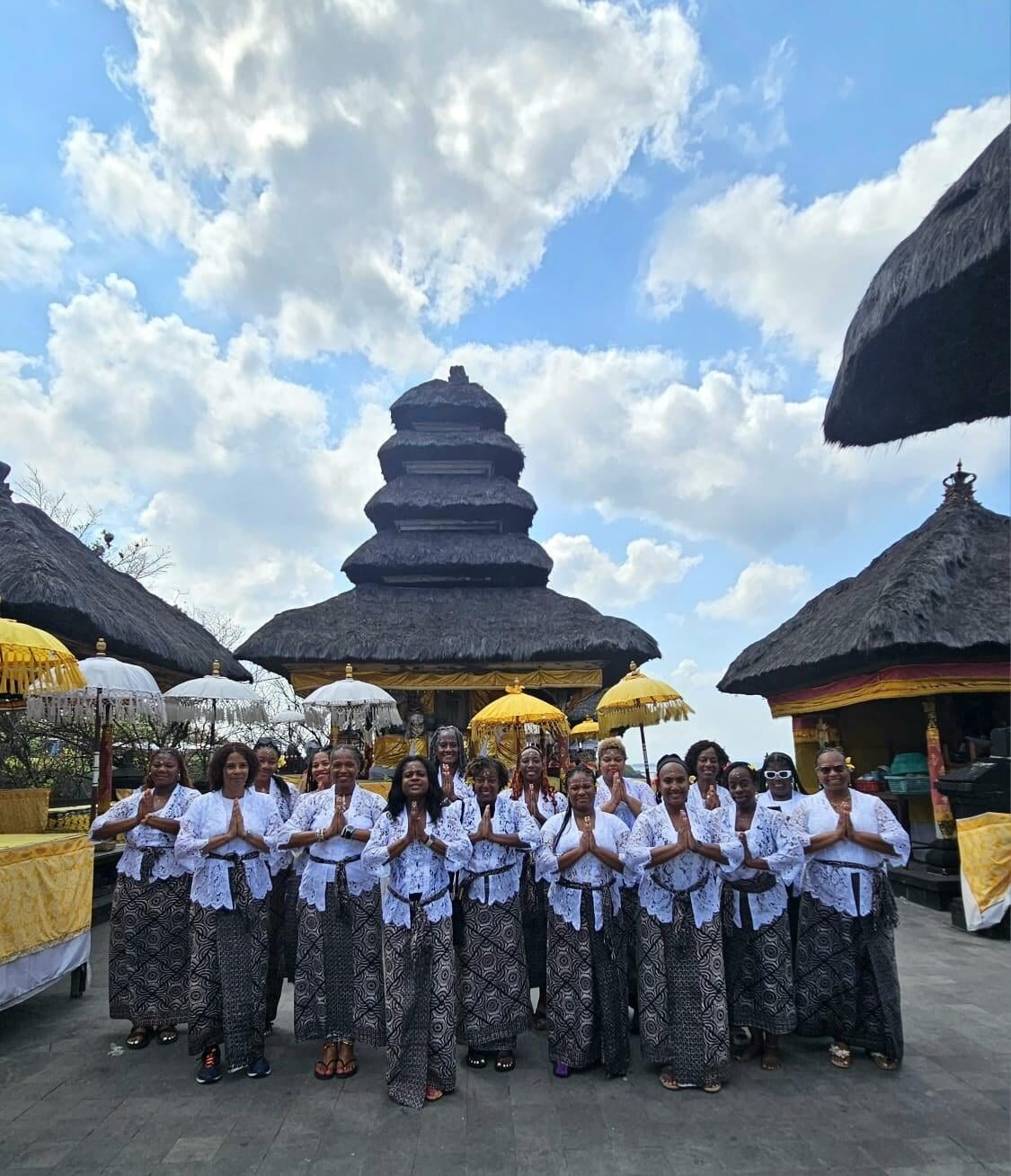 photo of a group of women all wearing gold shirts that say sisters