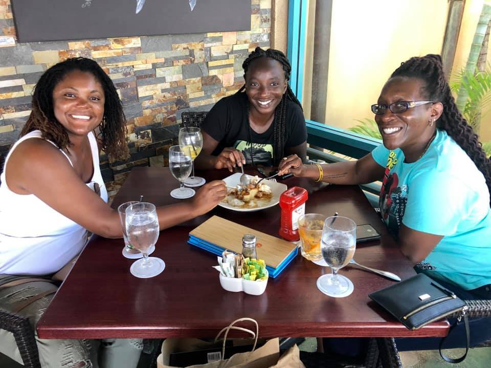 group of women sitting at a dinner table